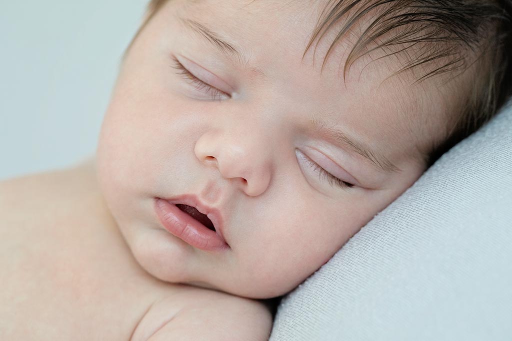 beautiful sleepy baby boy in private dallas studio