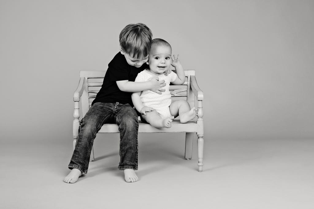 cute baby and dog pose for adorable black and white studio photos