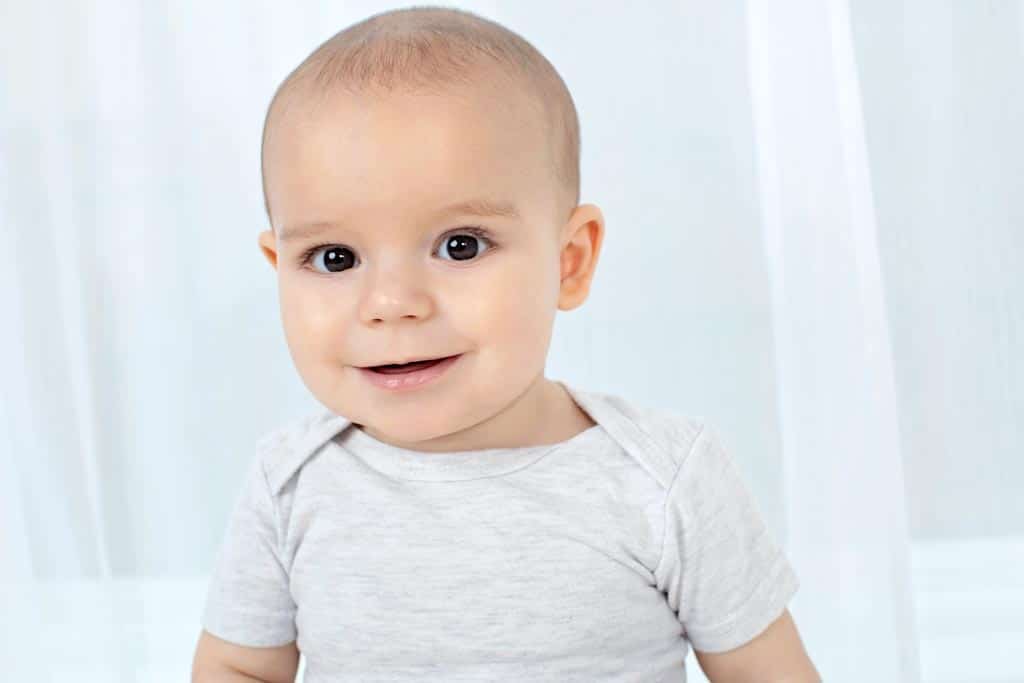 six-month baby is all smiles in private studio session