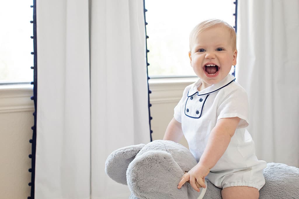 gorgeous one year old boy celebrating his first birthday in a beautiful at-home session