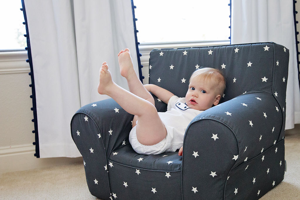 gorgeous one year old boy celebrating his first birthday in a beautiful at-home session