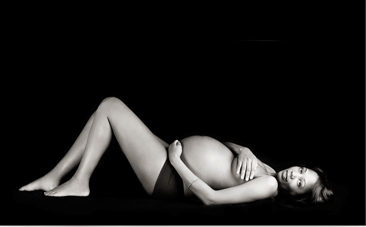 beautiful expecting mom posing in private dallas studio