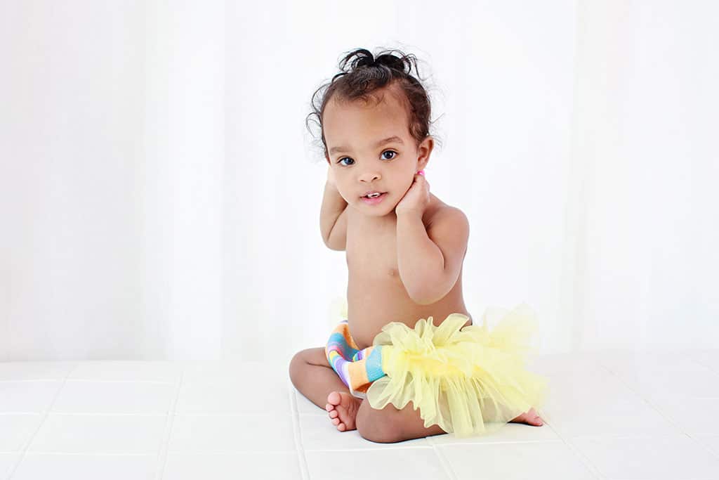 one year old crawling around in dallas studio to celebrate first birthday