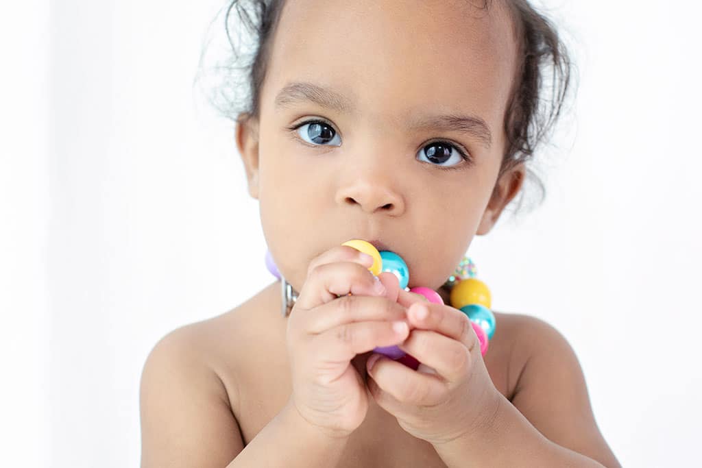 one year old crawling around in dallas studio to celebrate first birthday