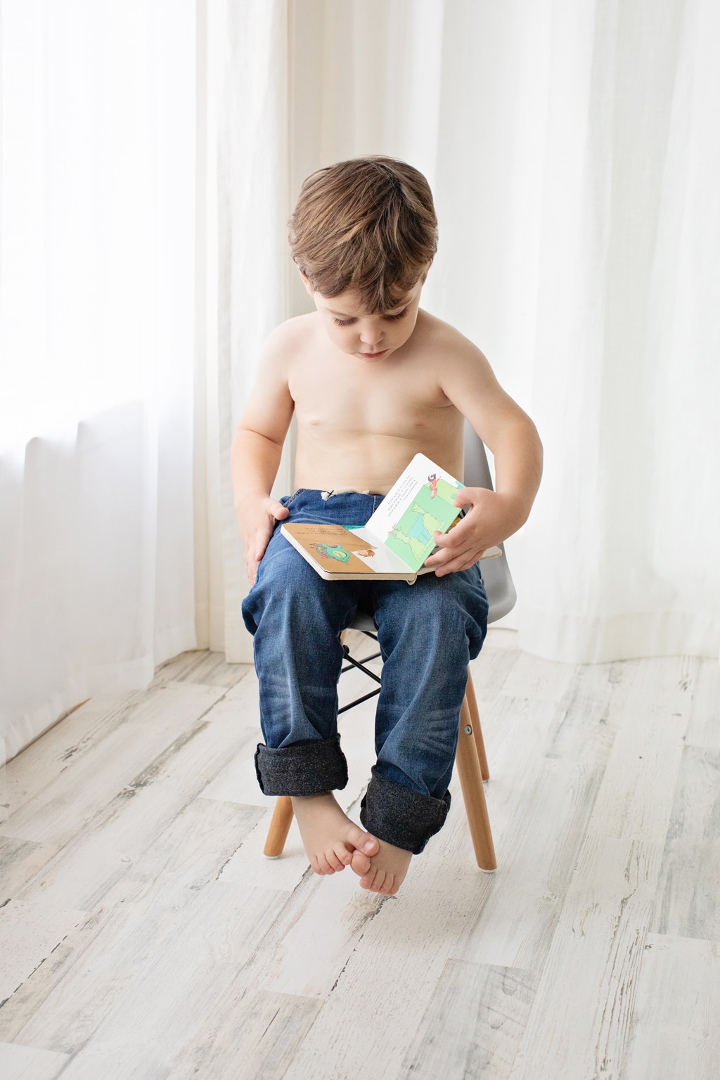 cute boy reads in private studio session