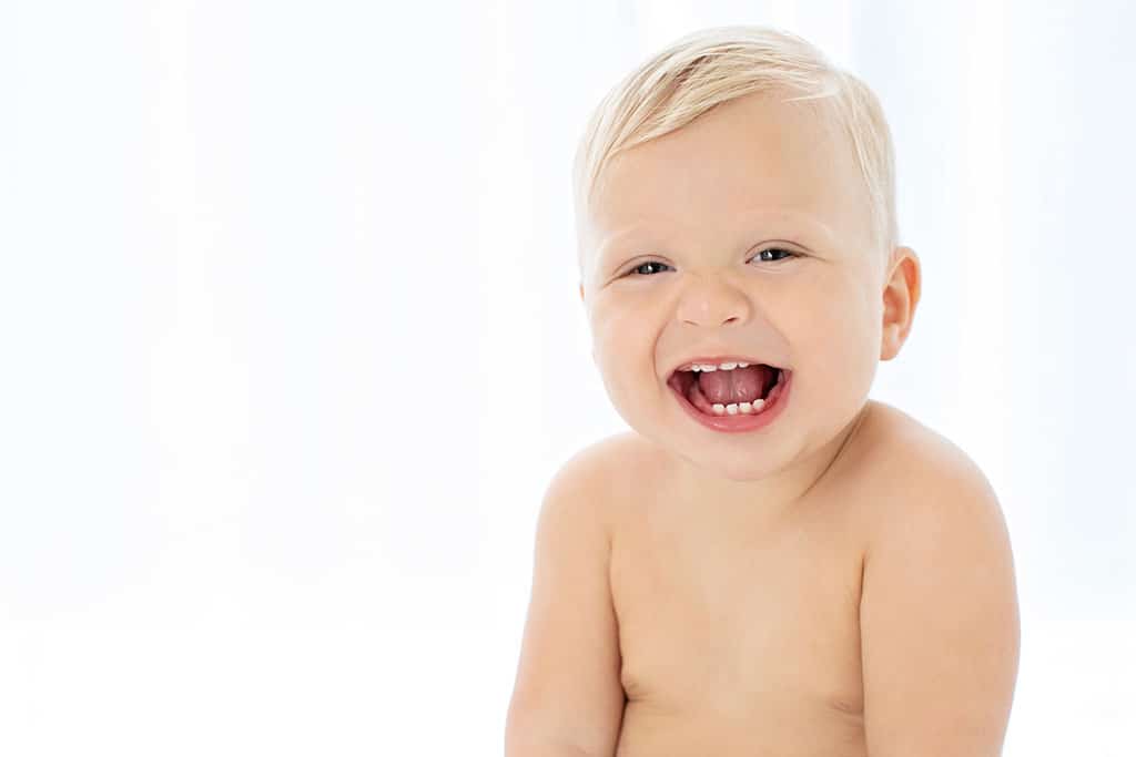 adorable one year old blue eyed toddler in private dallas studio