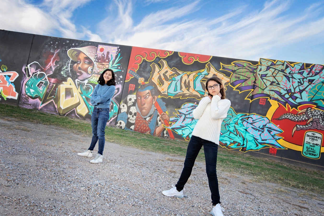 sisters posing in Dallas for a fun urban session