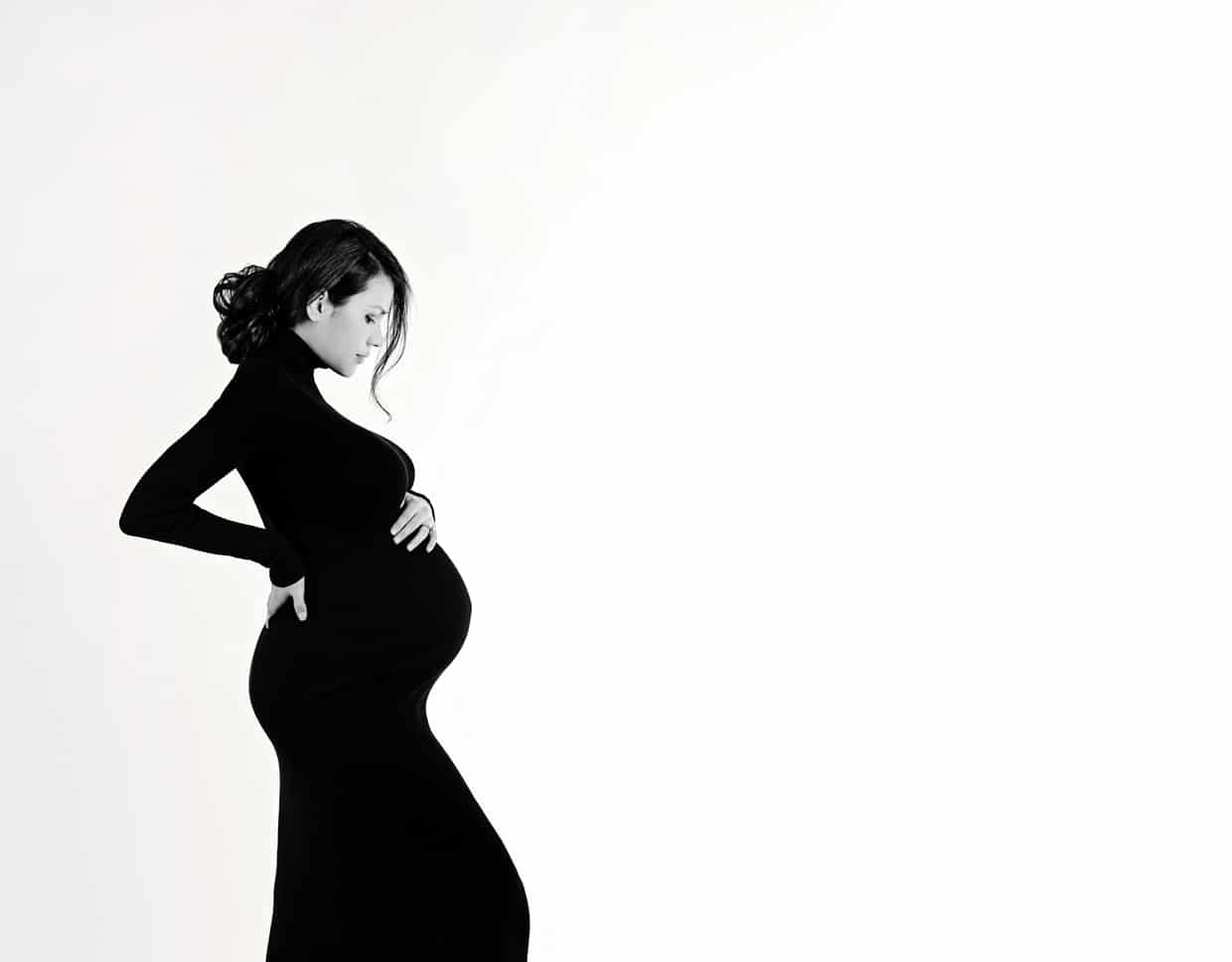 Expecting mother poses in dallas studio session