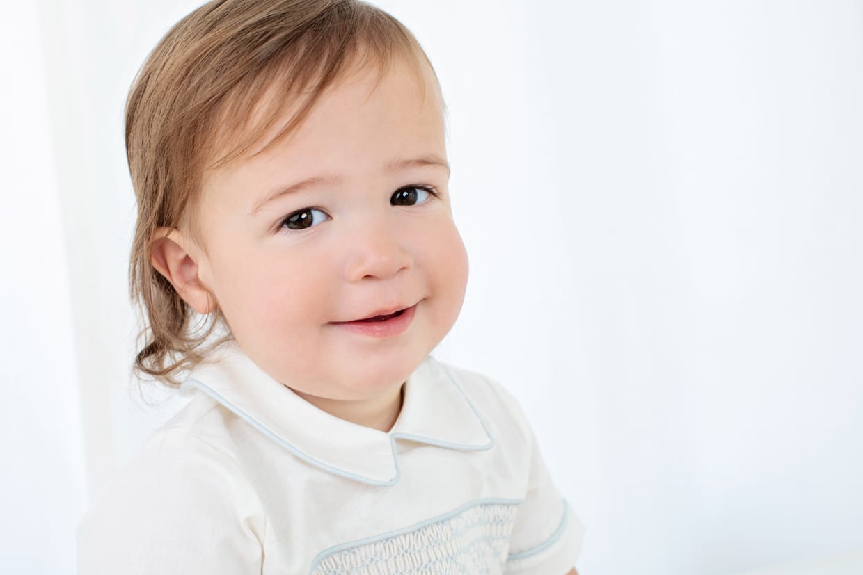 the most charming baby boy posing in private studio
