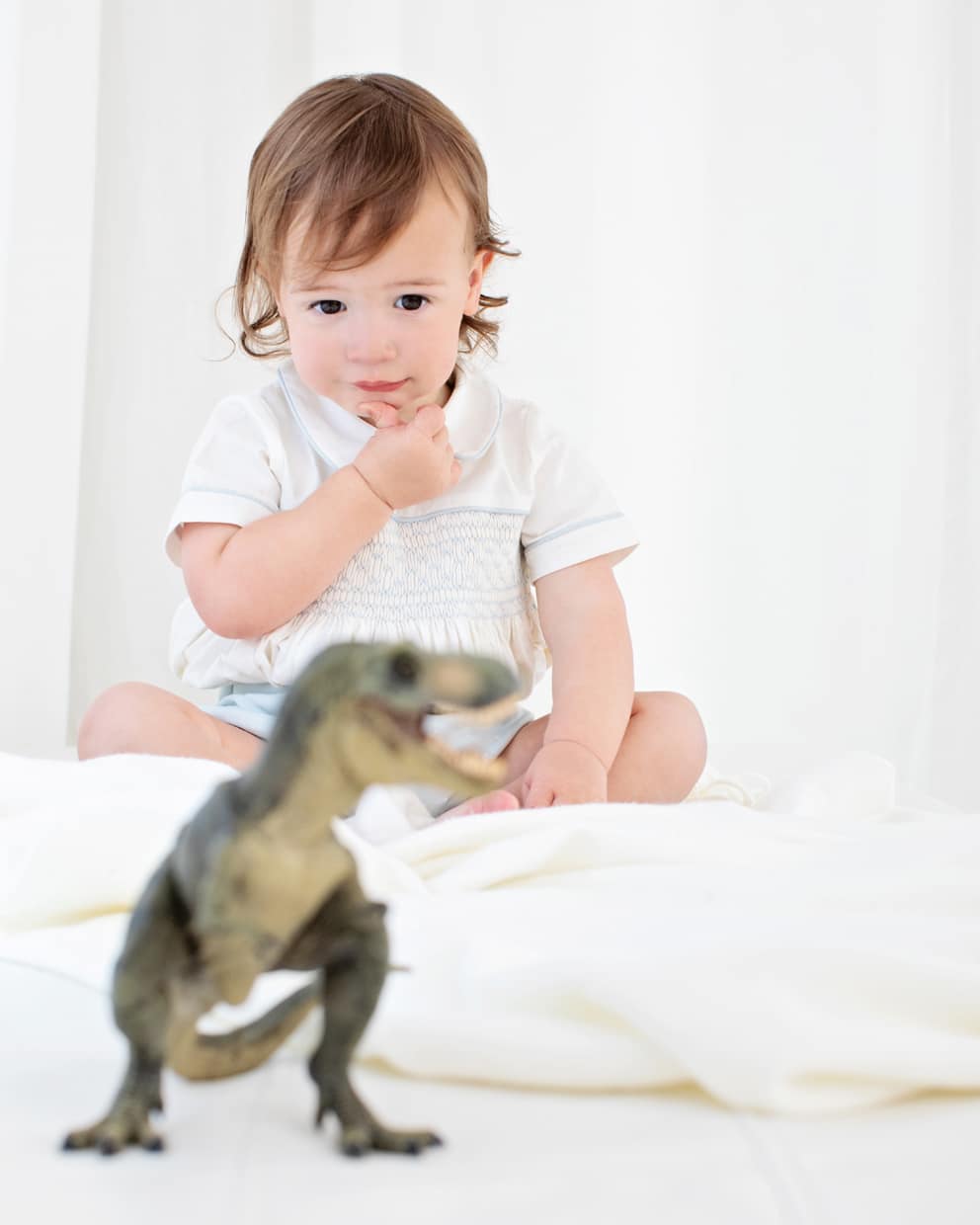 the most charming baby boy posing in private studio