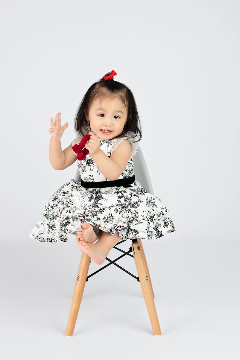 little angel posing in dallas studio session for holiday session