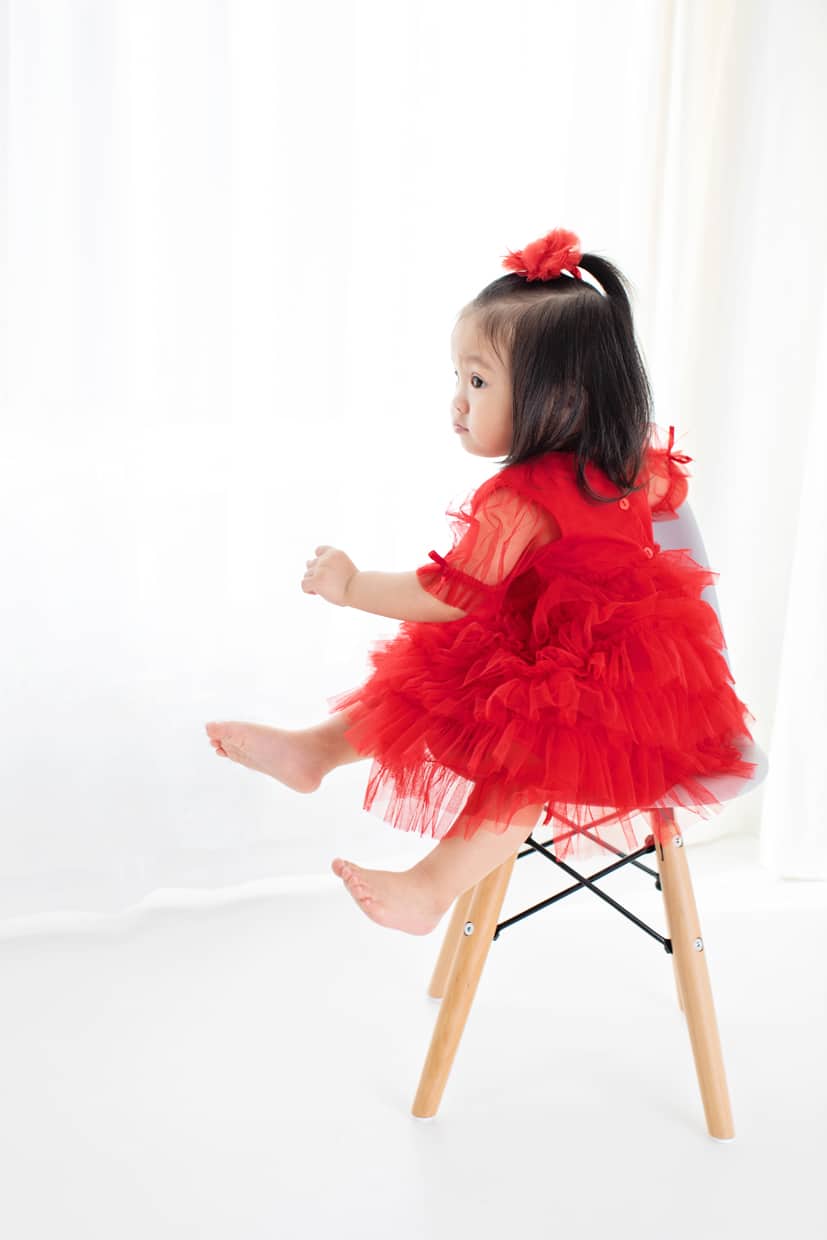 little angel posing in dallas studio session for holiday session