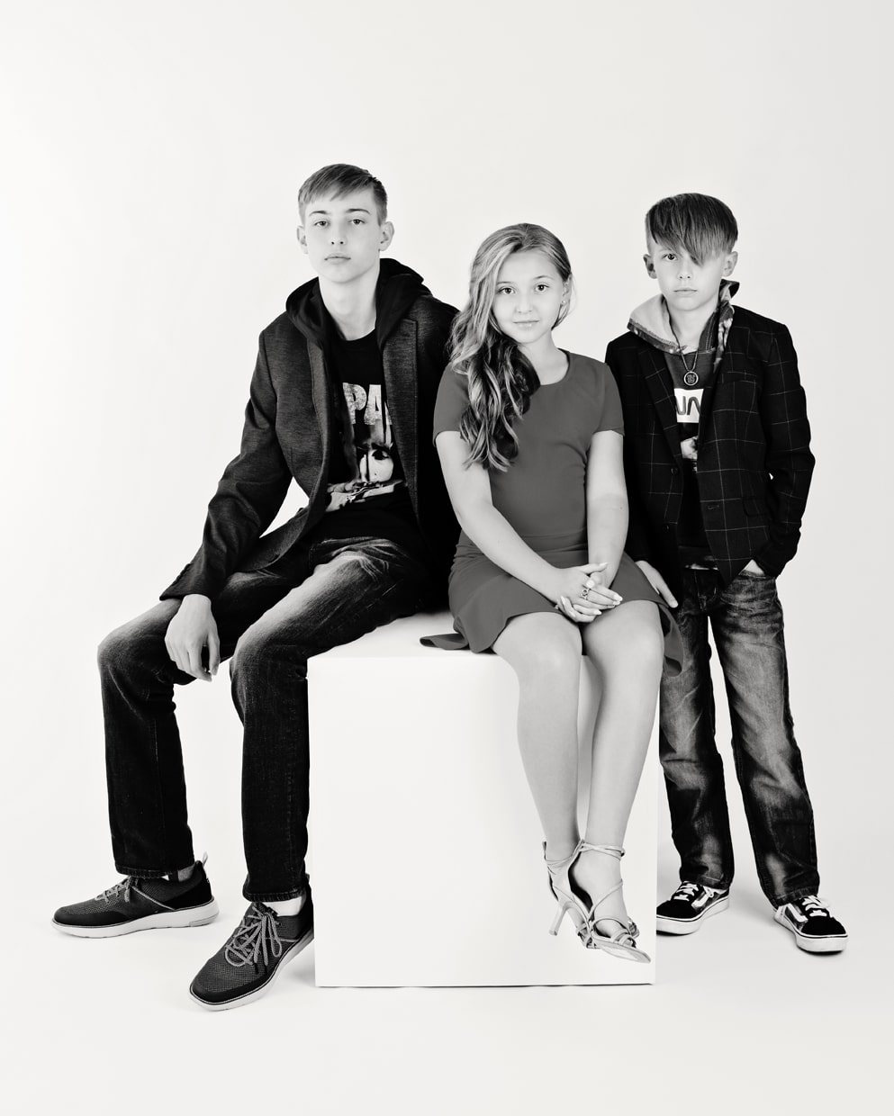 adorable group of siblings strike a pose for family session