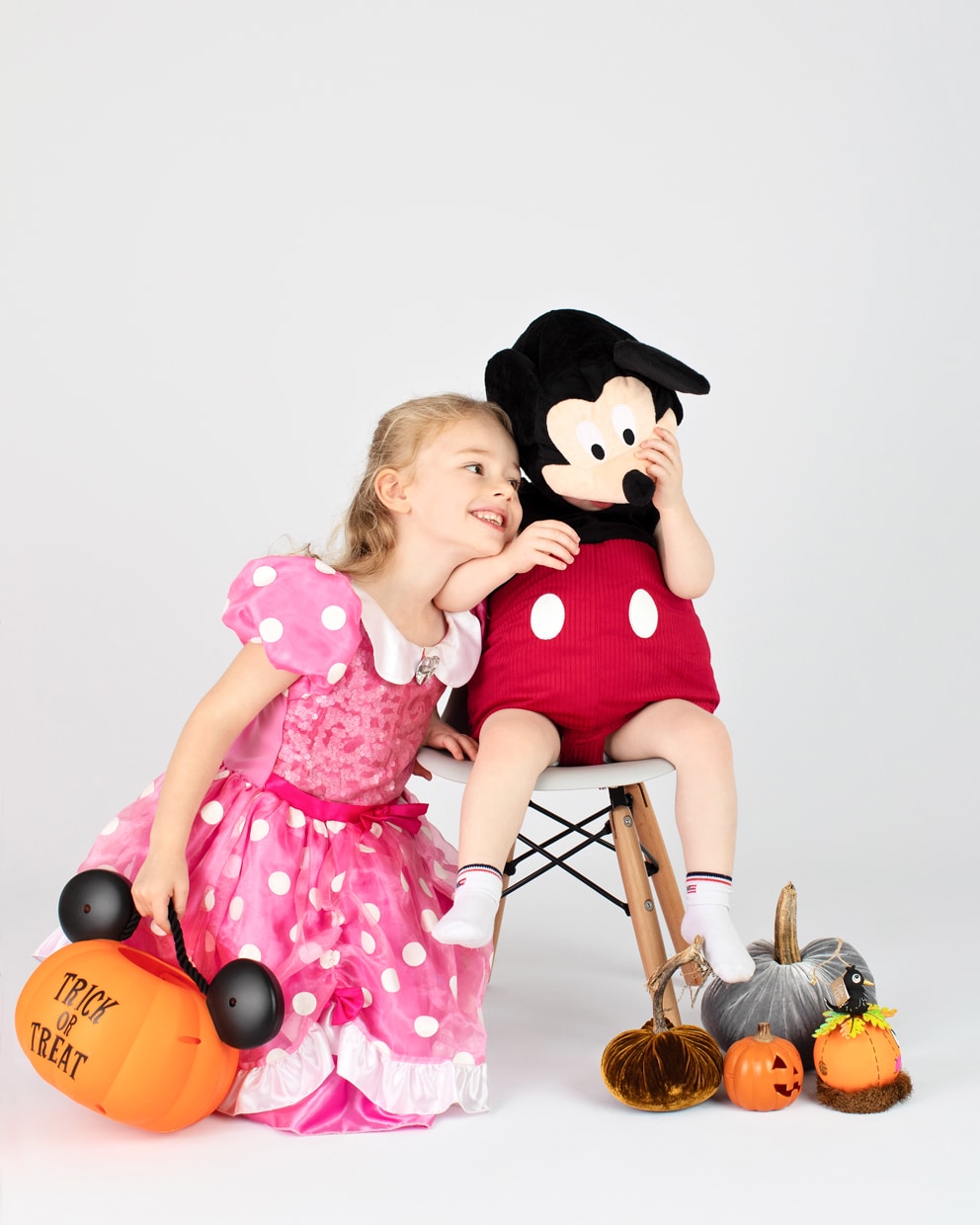 brother and sister dressed up like Minnie and Mickey Mouse for halloween