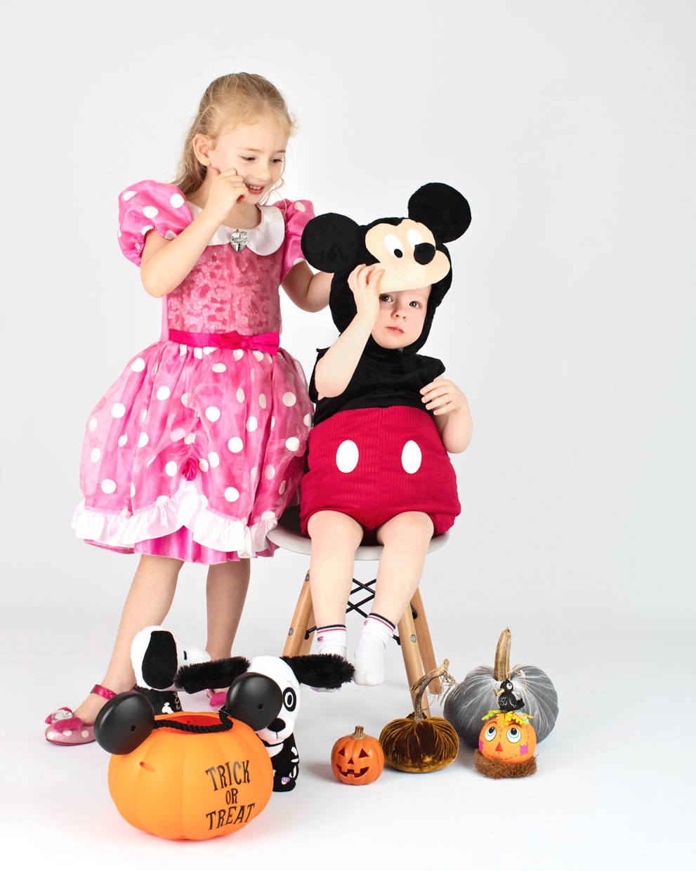 brother and sister dressed up like Minnie and Mickey Mouse for halloween