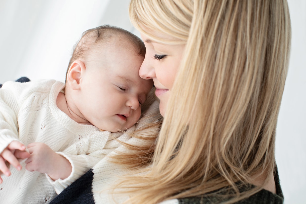 two-month-old snuggled up with mom after a big day in the private Dallas studio.