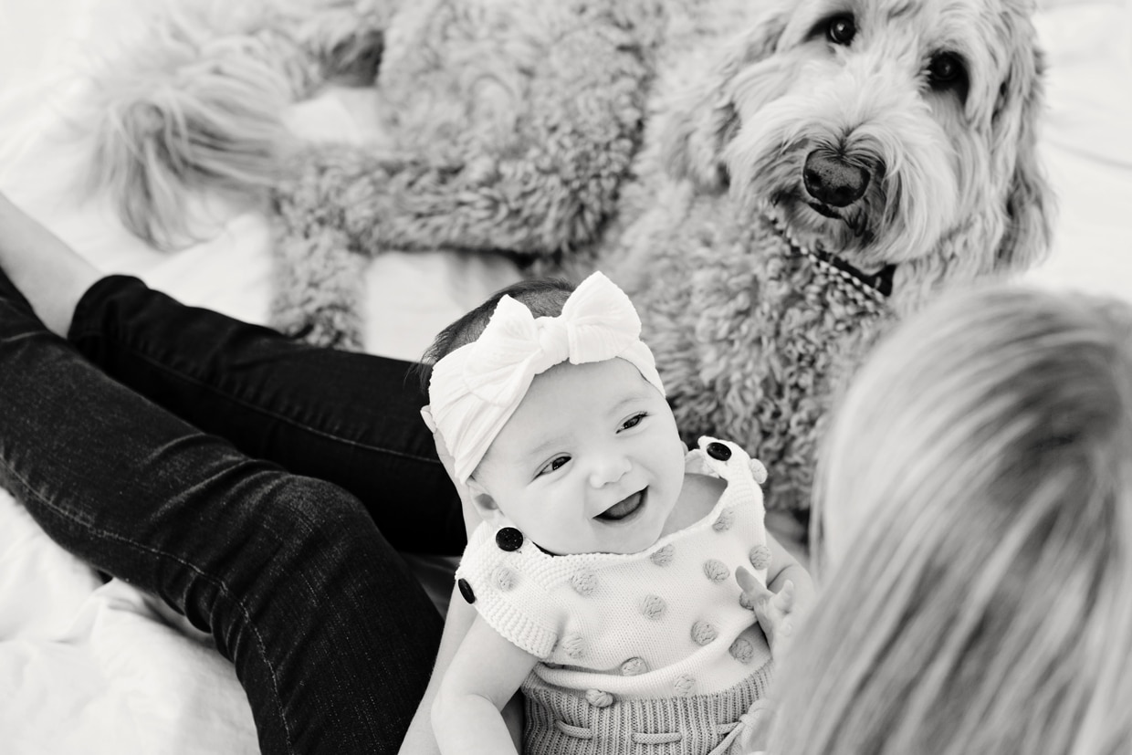 gorgeous black and white newborn photography. Two-month old baby smiling up at mom.