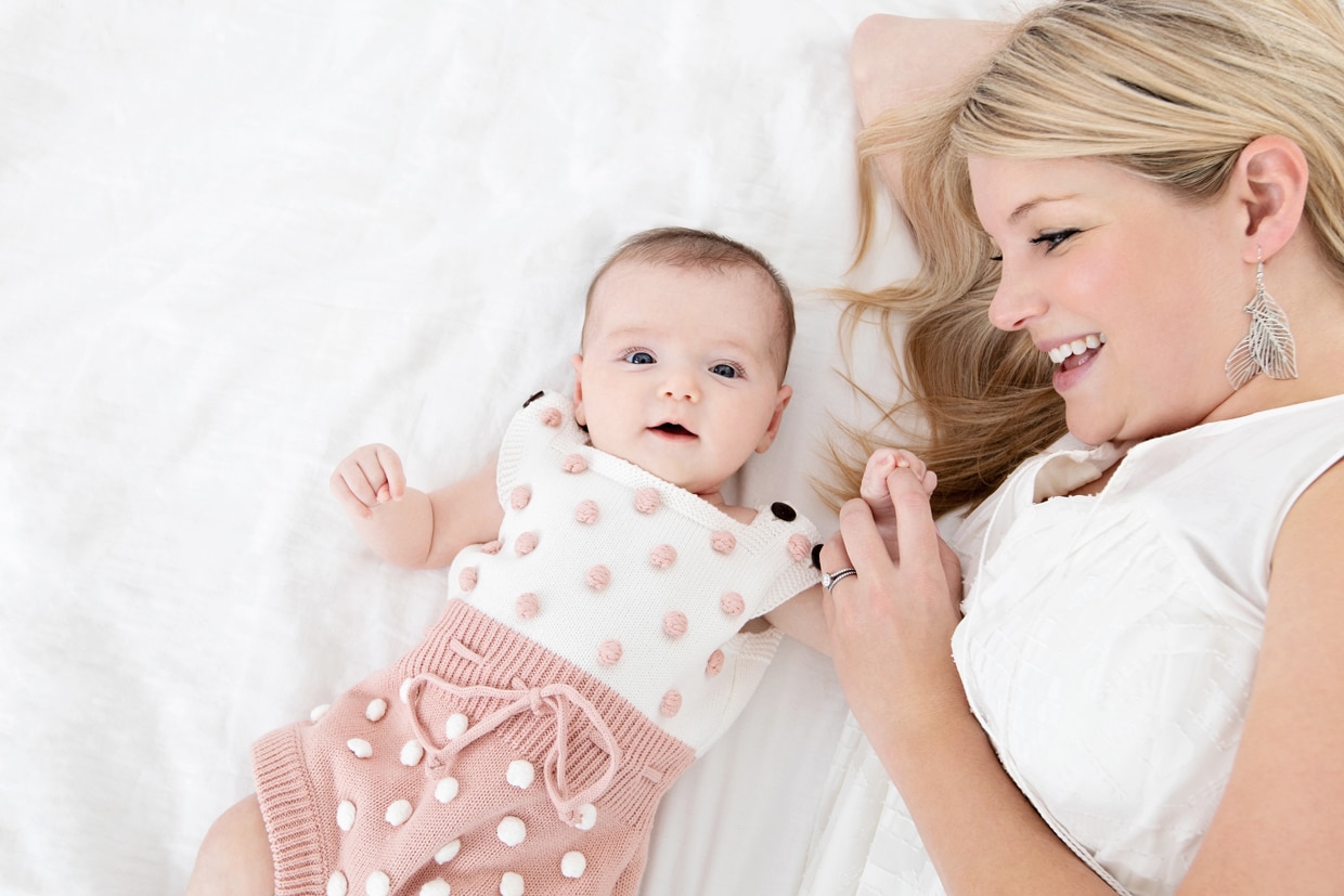 adorable baby girl in knit outfit with mom in dallas newborn photography session