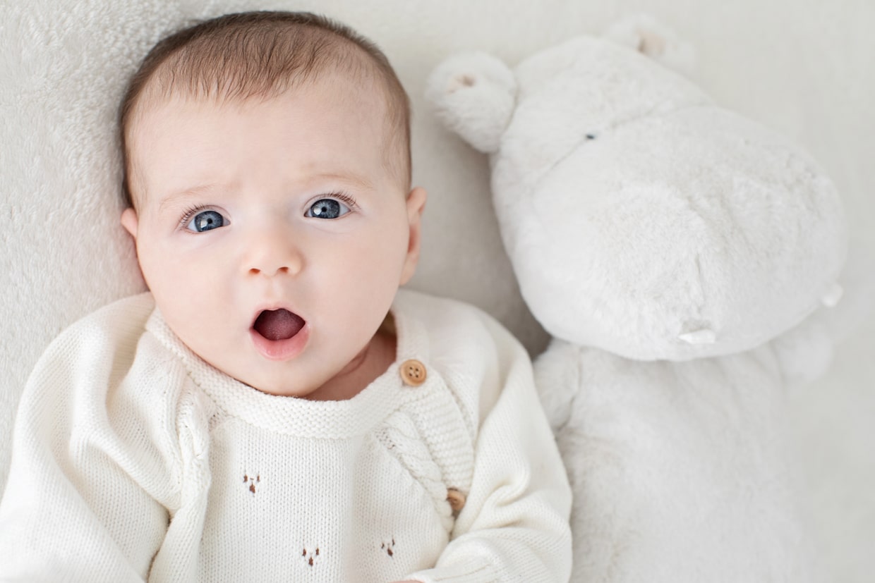 cutest baby girl poses with stuffed animal in dallas studio session