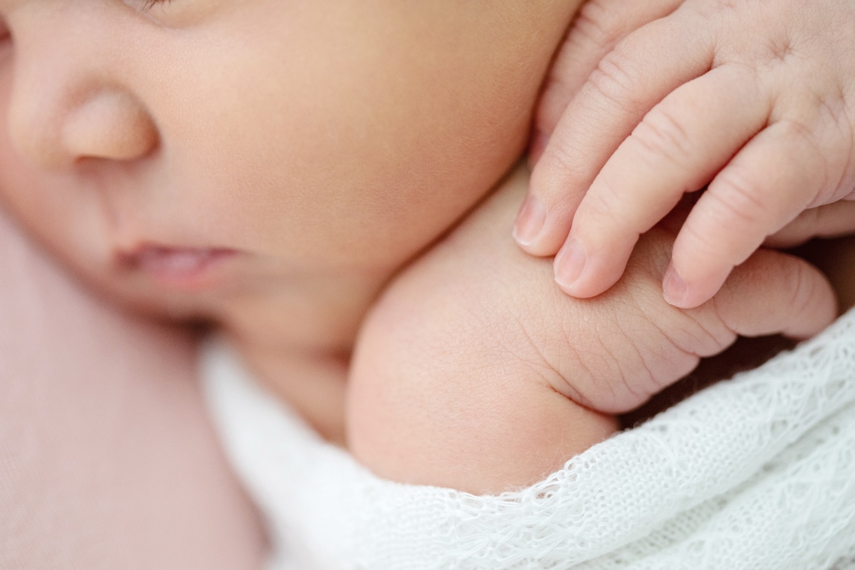 gorgeous close-up of newborn's face and hands
