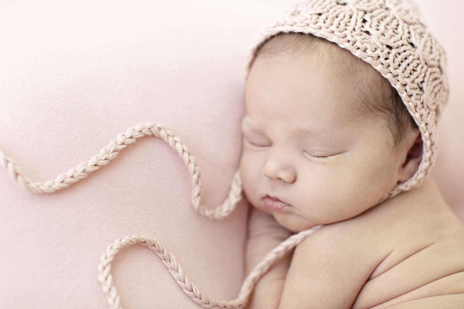 newborn baby on pink background for baby album
