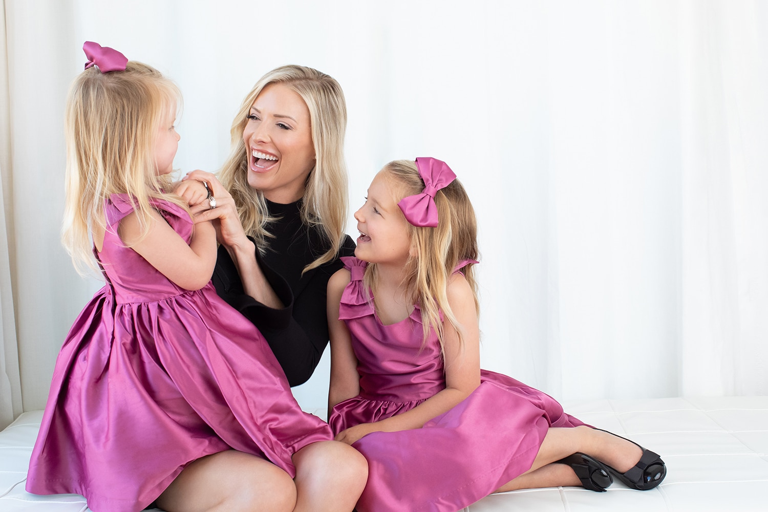 A mom with her family at Miette Photography.