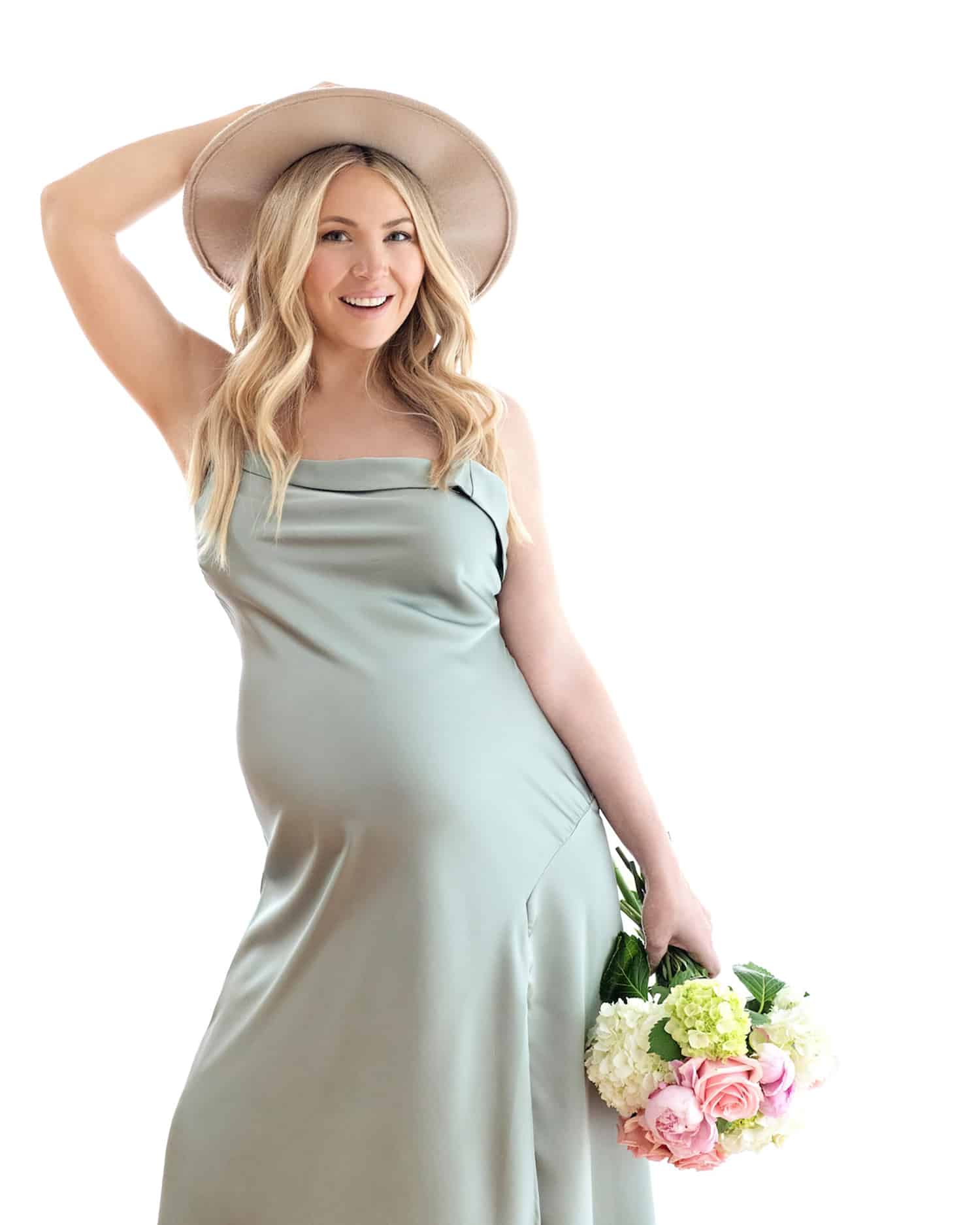 A woman with a hair accessory in a maternity shoot.