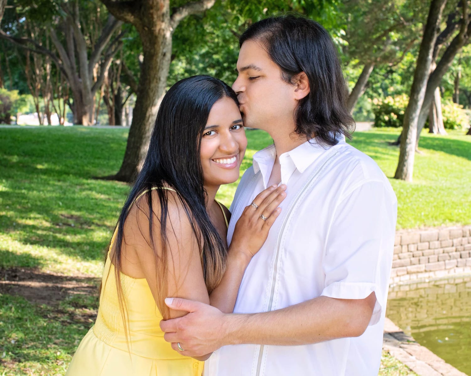 A couple take a photo outdoors.