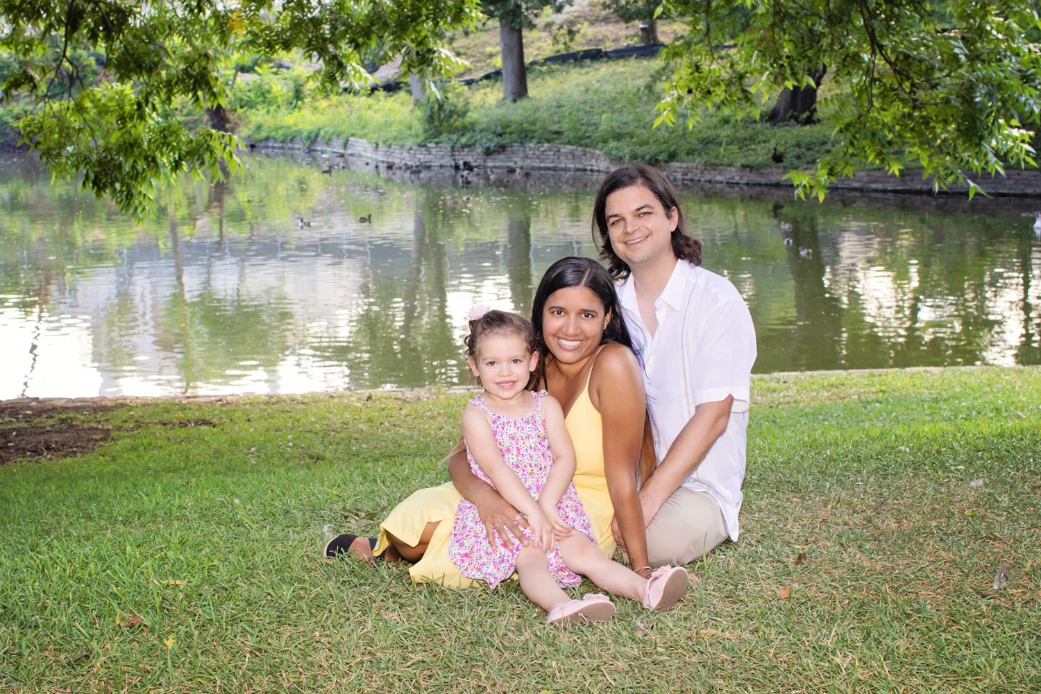 A family takes a photo outdoors.