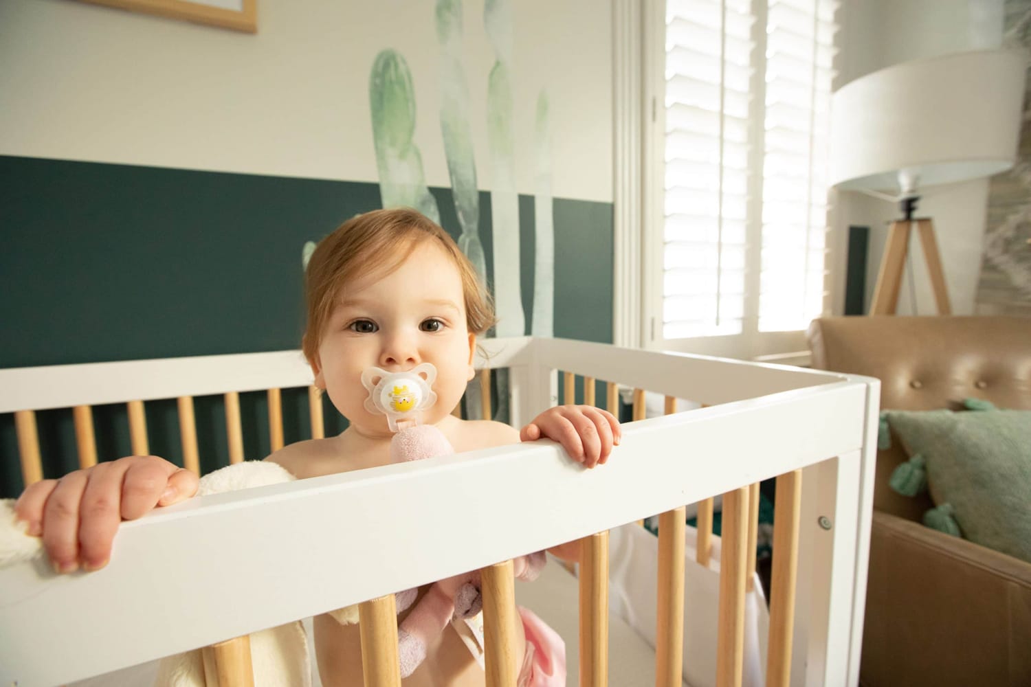 A baby's photo is taken in their home.