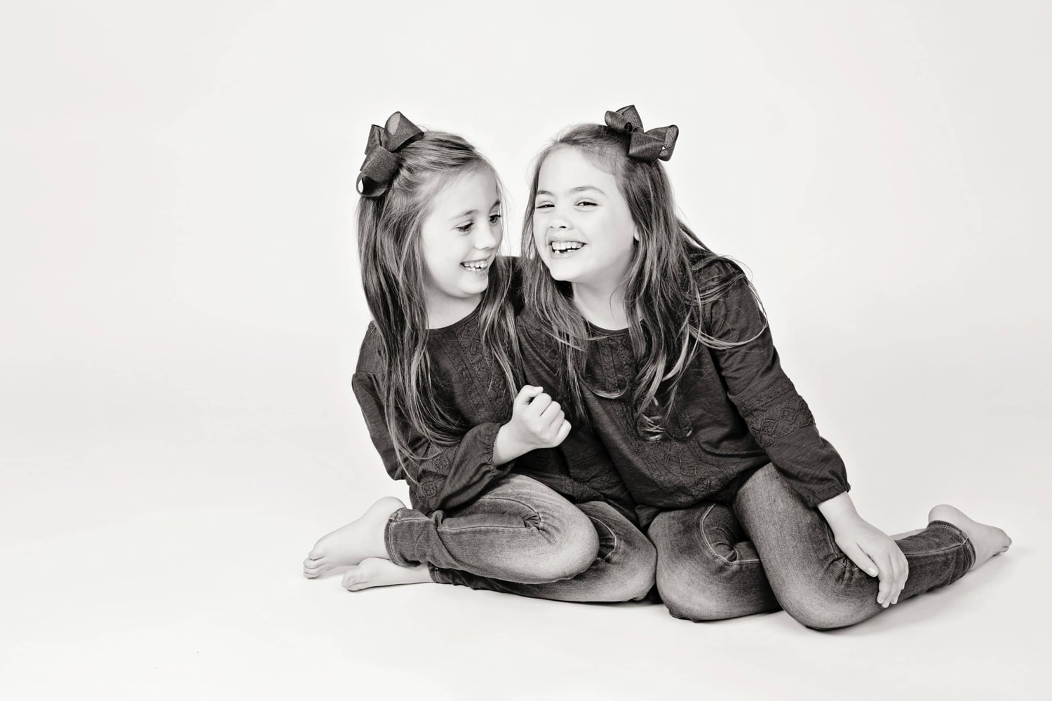 Two girls take photos in the Miette Photography studio.