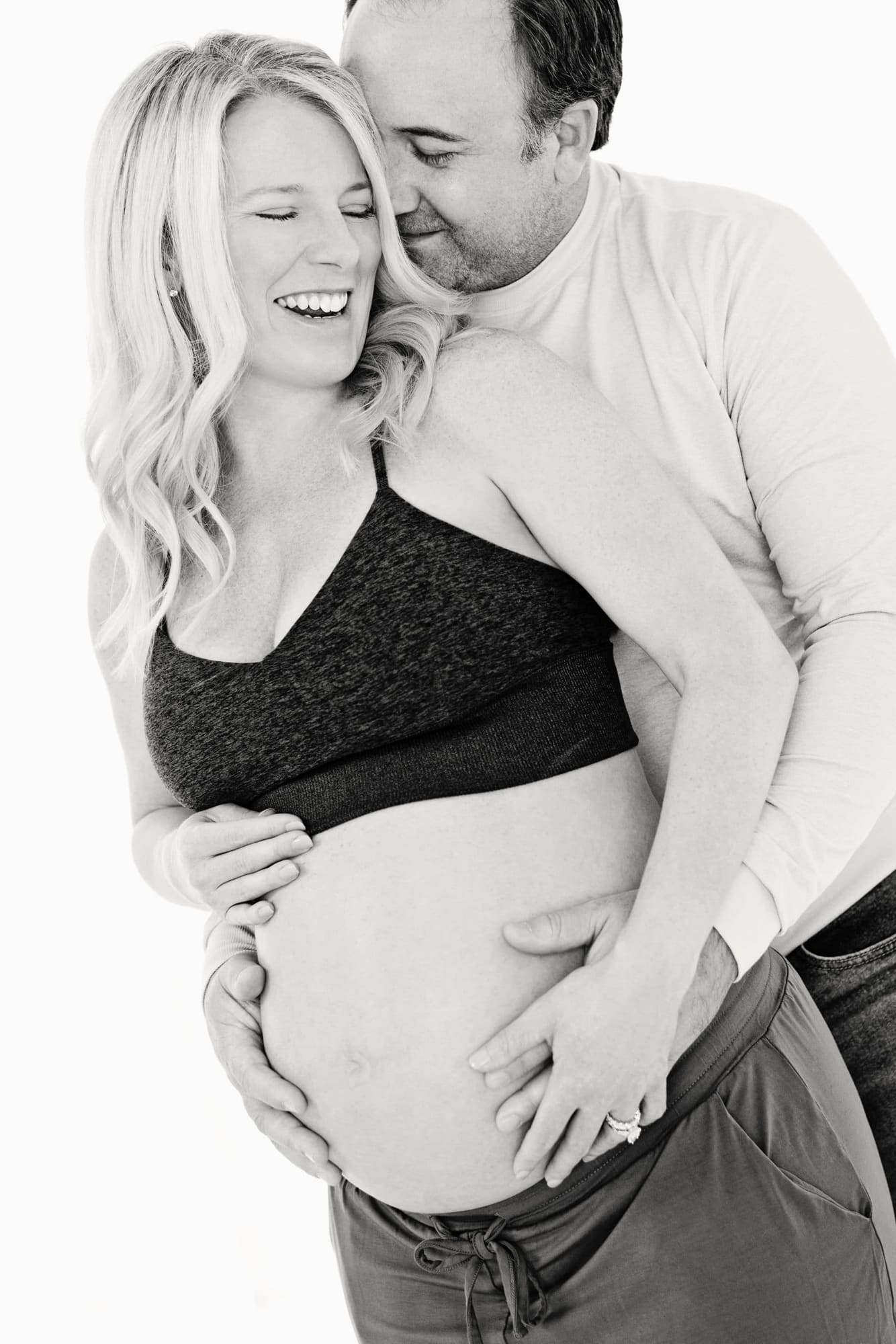 An expecting couple in a maternity portrait.