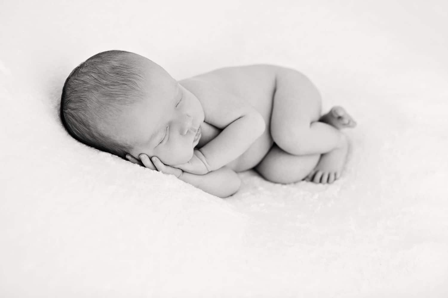 Newborn baby portrait in black and white.