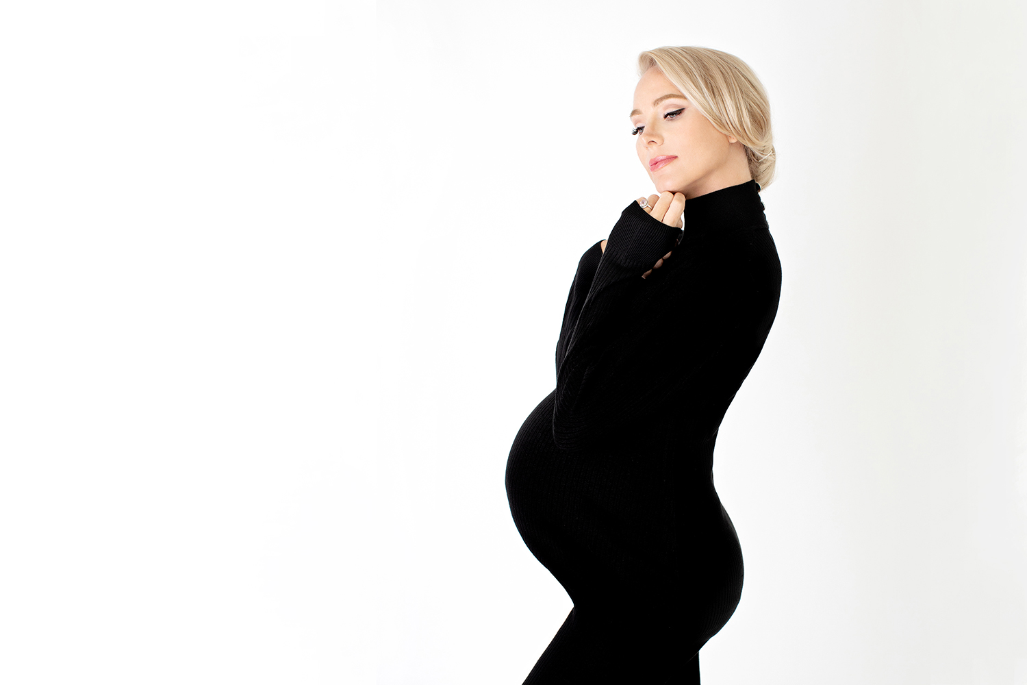 FASHION MATERNITY IMAGE OF PREGNANT WOMAN WITH UPDO HAIRSTYLE