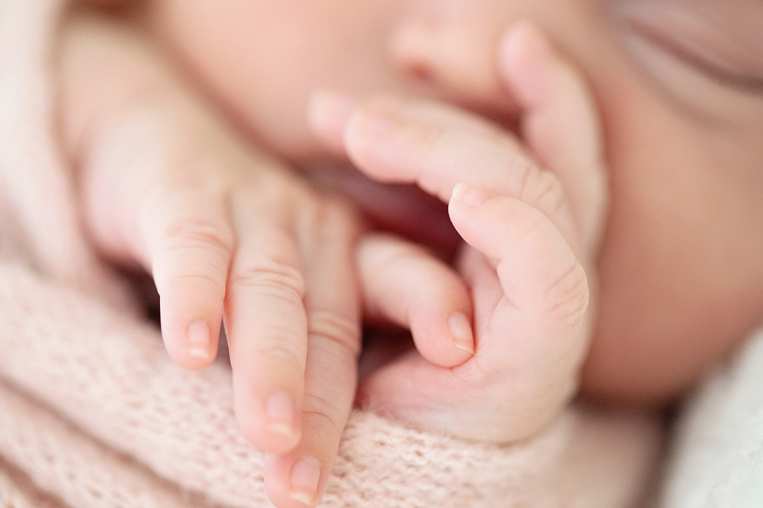 A newborn's tiny hands.