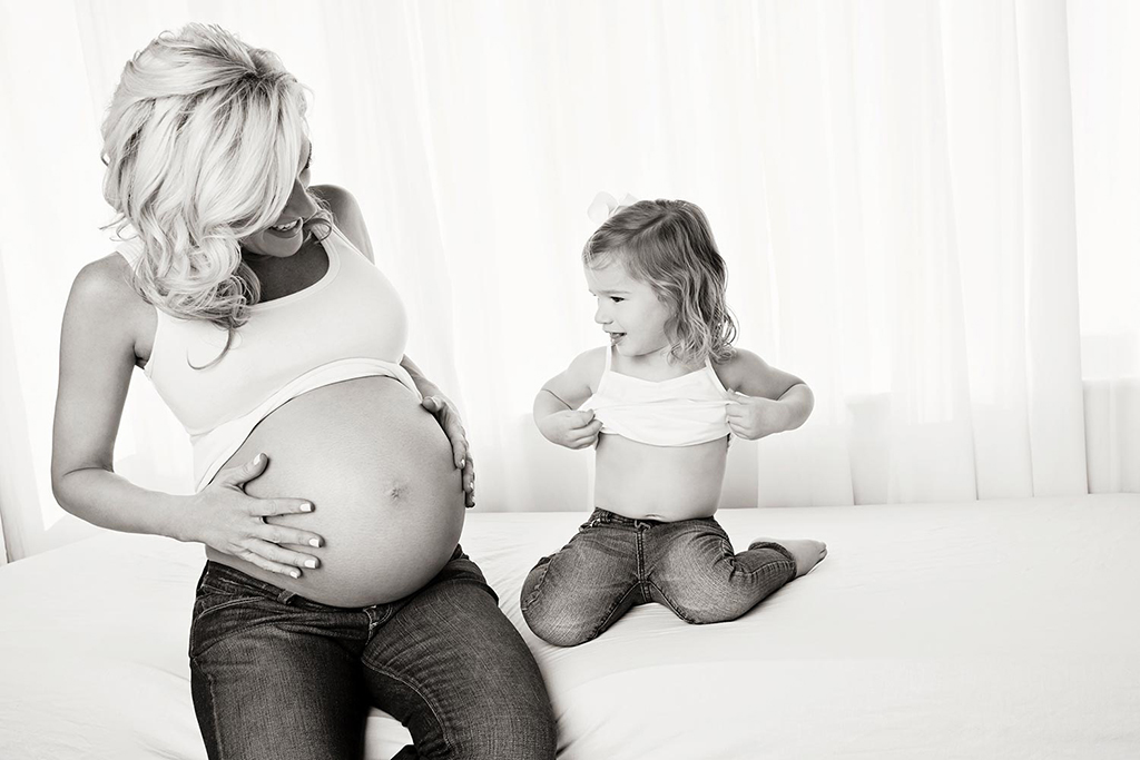 Pregnant mom and her daughter