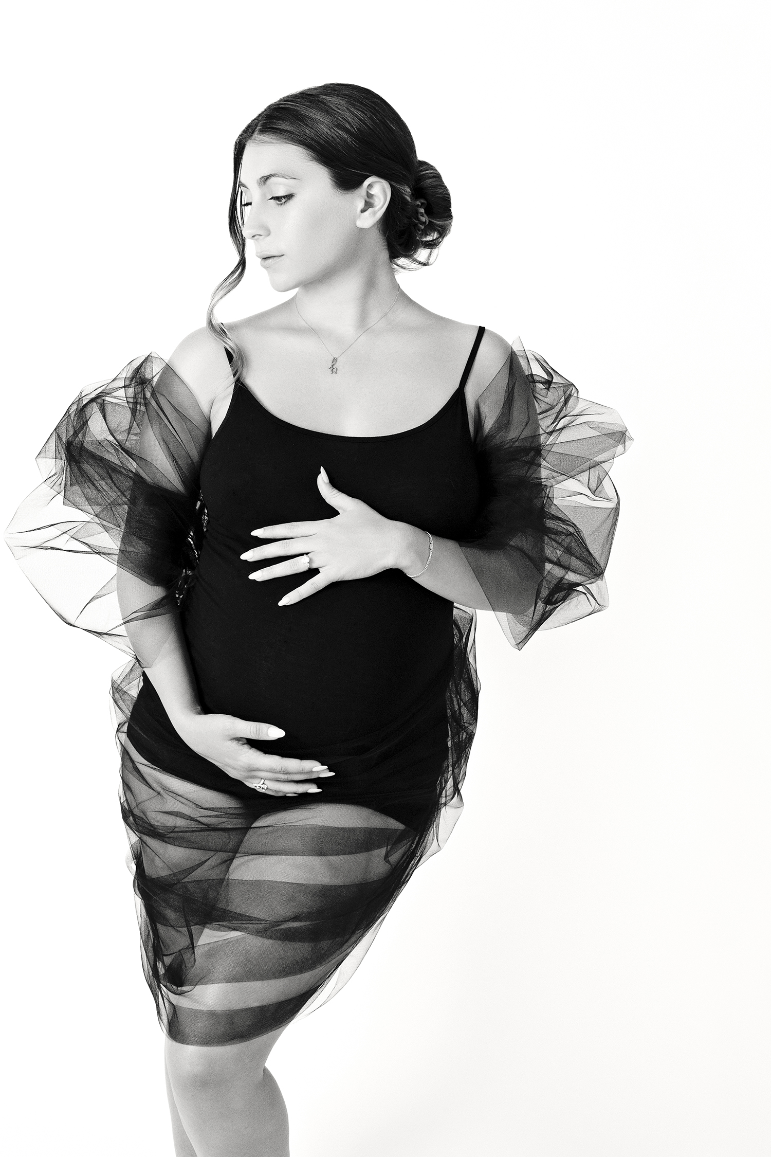 fashion image of pregnant woman in maternity pose