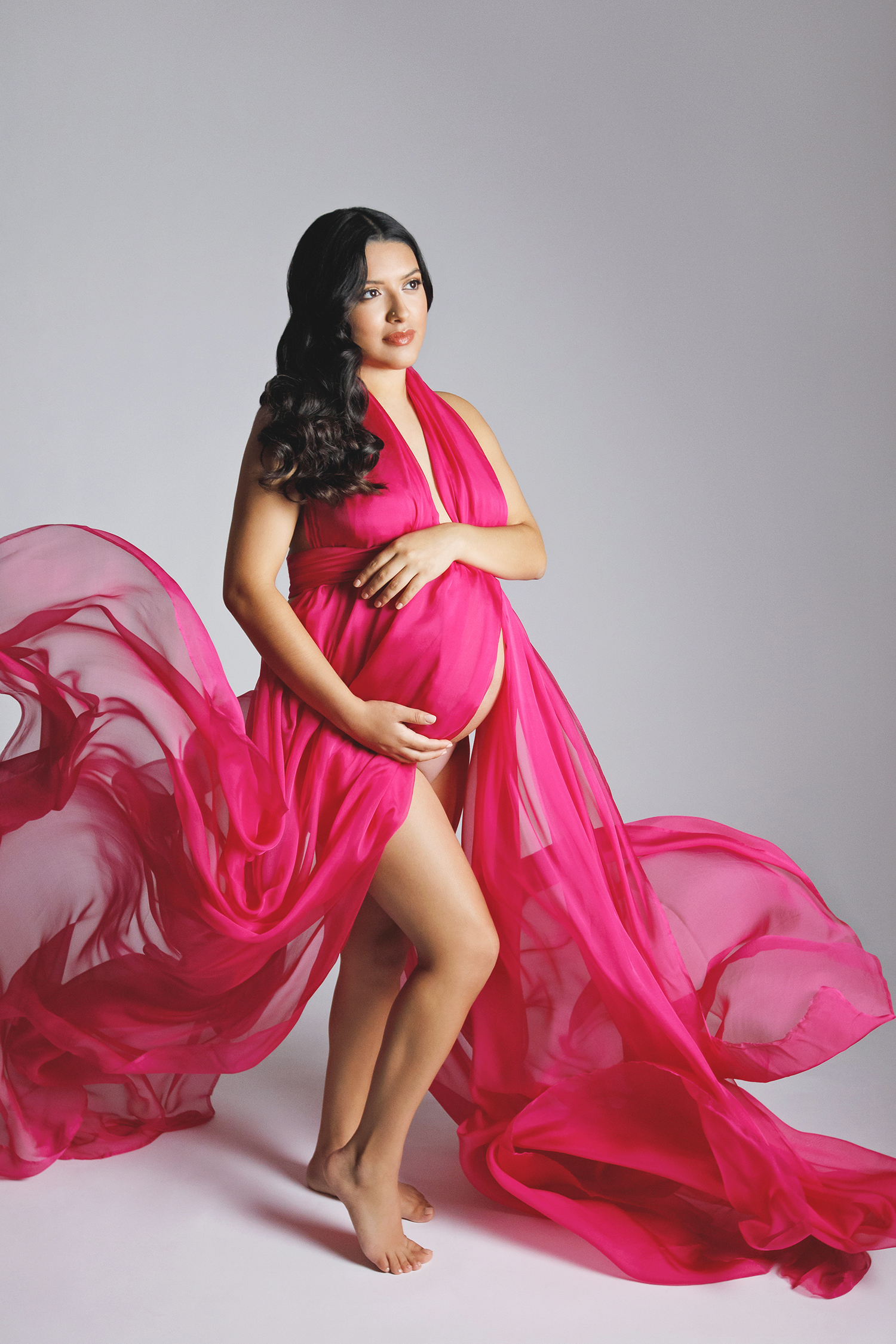 Expectant mother in a flowing silk gown