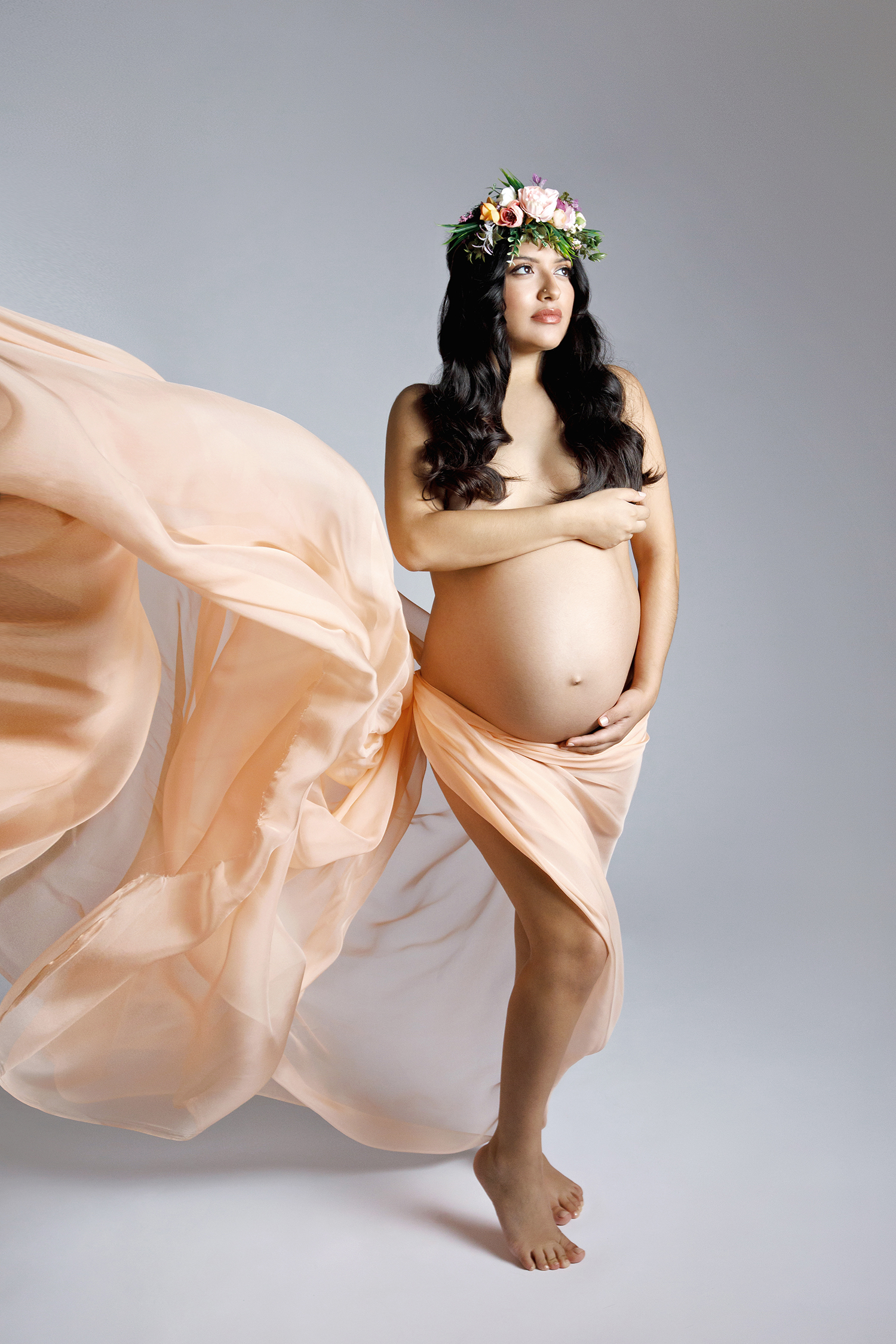Expectant mother in a flowing silk gown