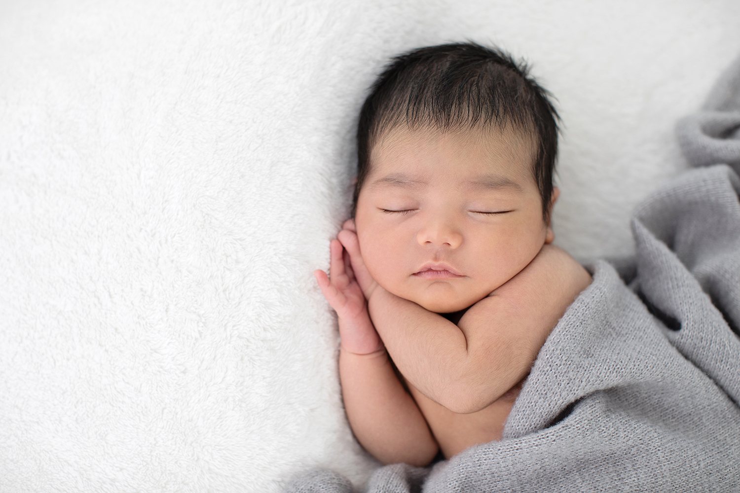 newborn baby wrapped in a soft, cozy blanket