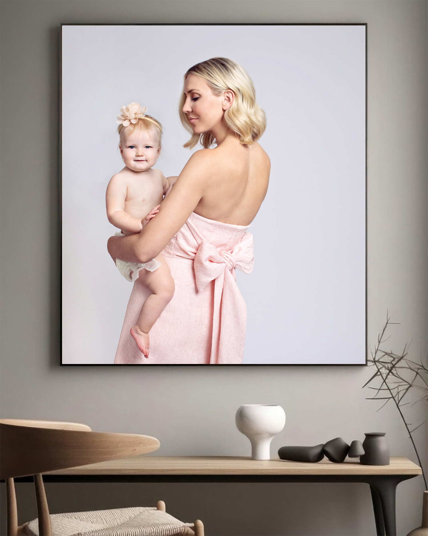 A framed photo of mom and baby in a relaxed and stylish photoshoot.