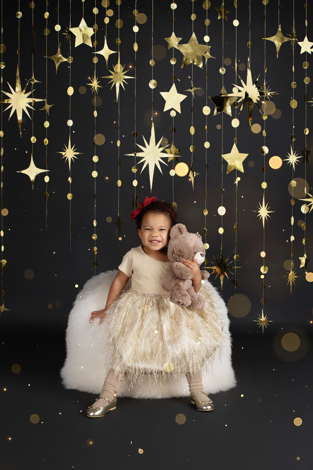 a little girl posing in a gold dress during a Dallas family photoshoot