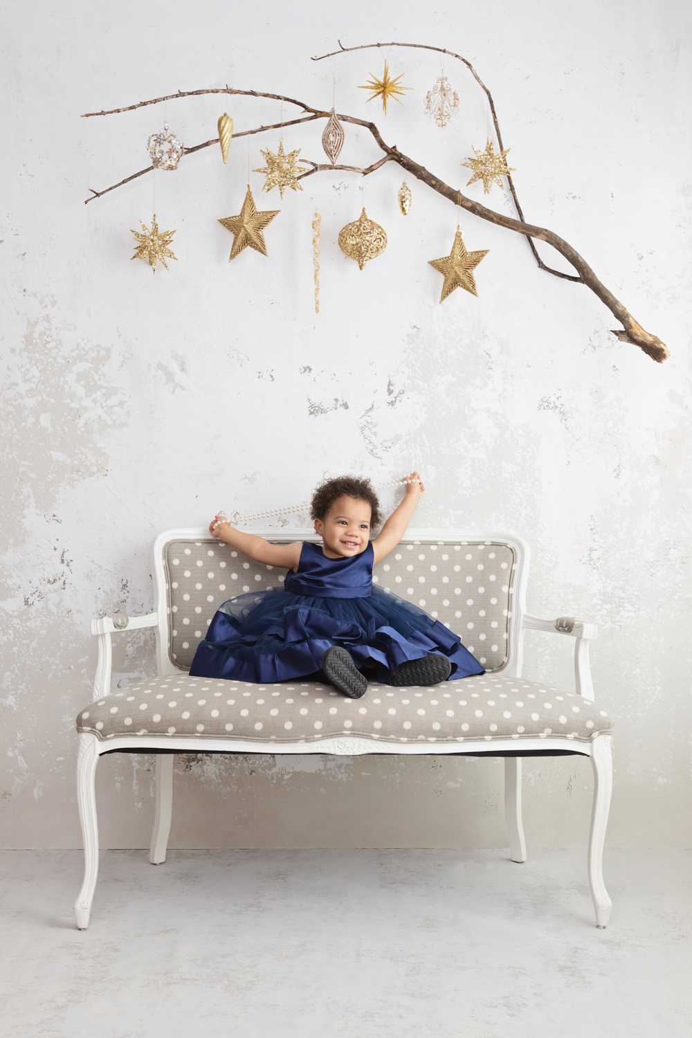 a little girl posing in a blue dress during a Dallas family photoshoot