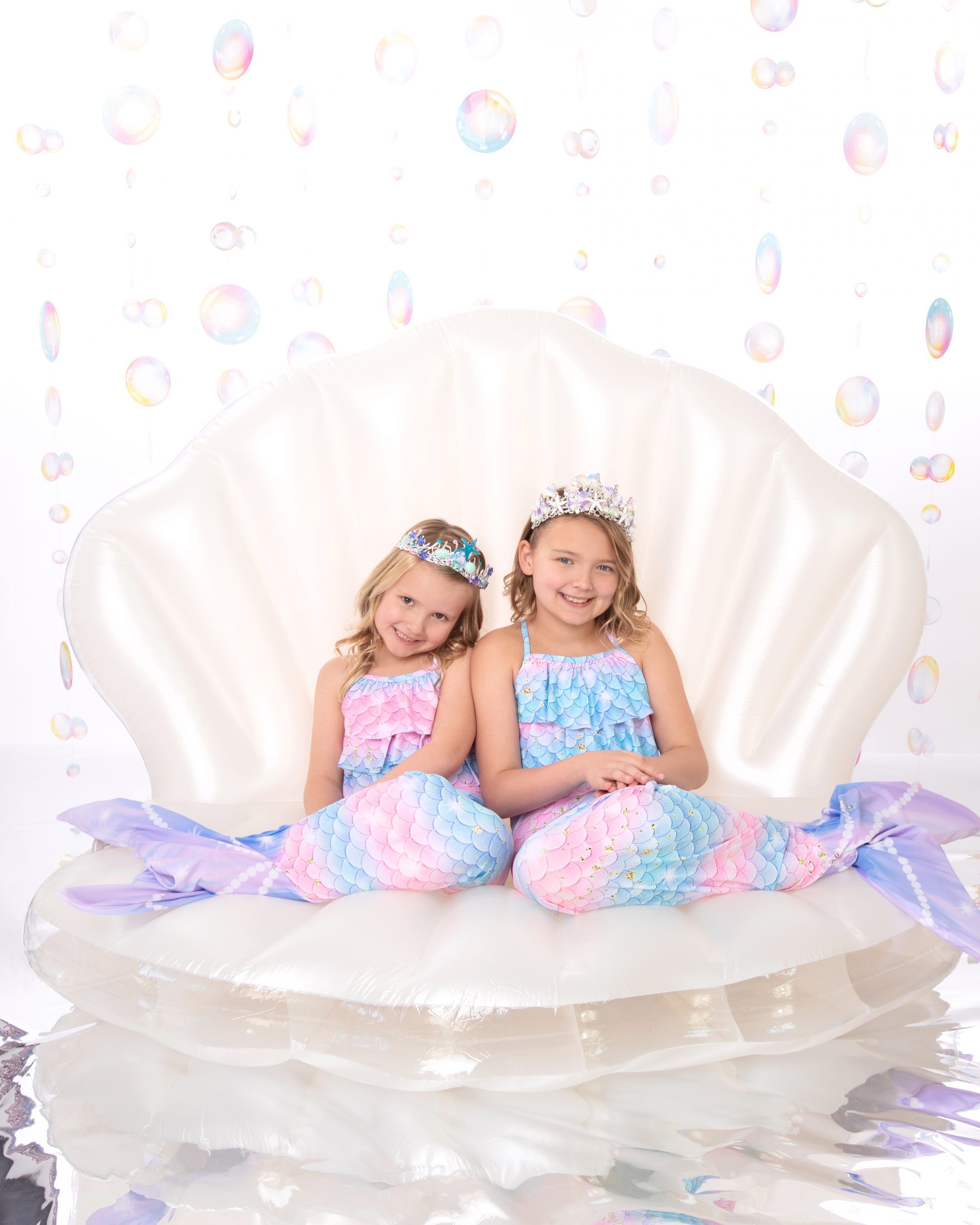 Girls wearing mermaid costumes in a Dallas family photoshoot