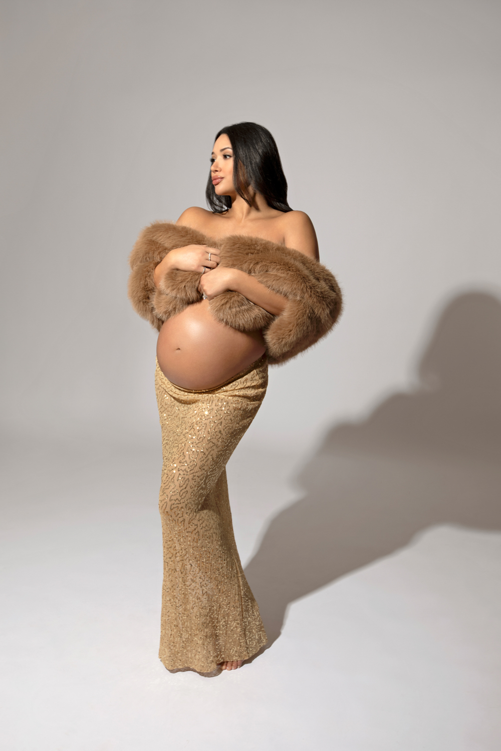 Elegant maternity photos with fur Dallas photographer
