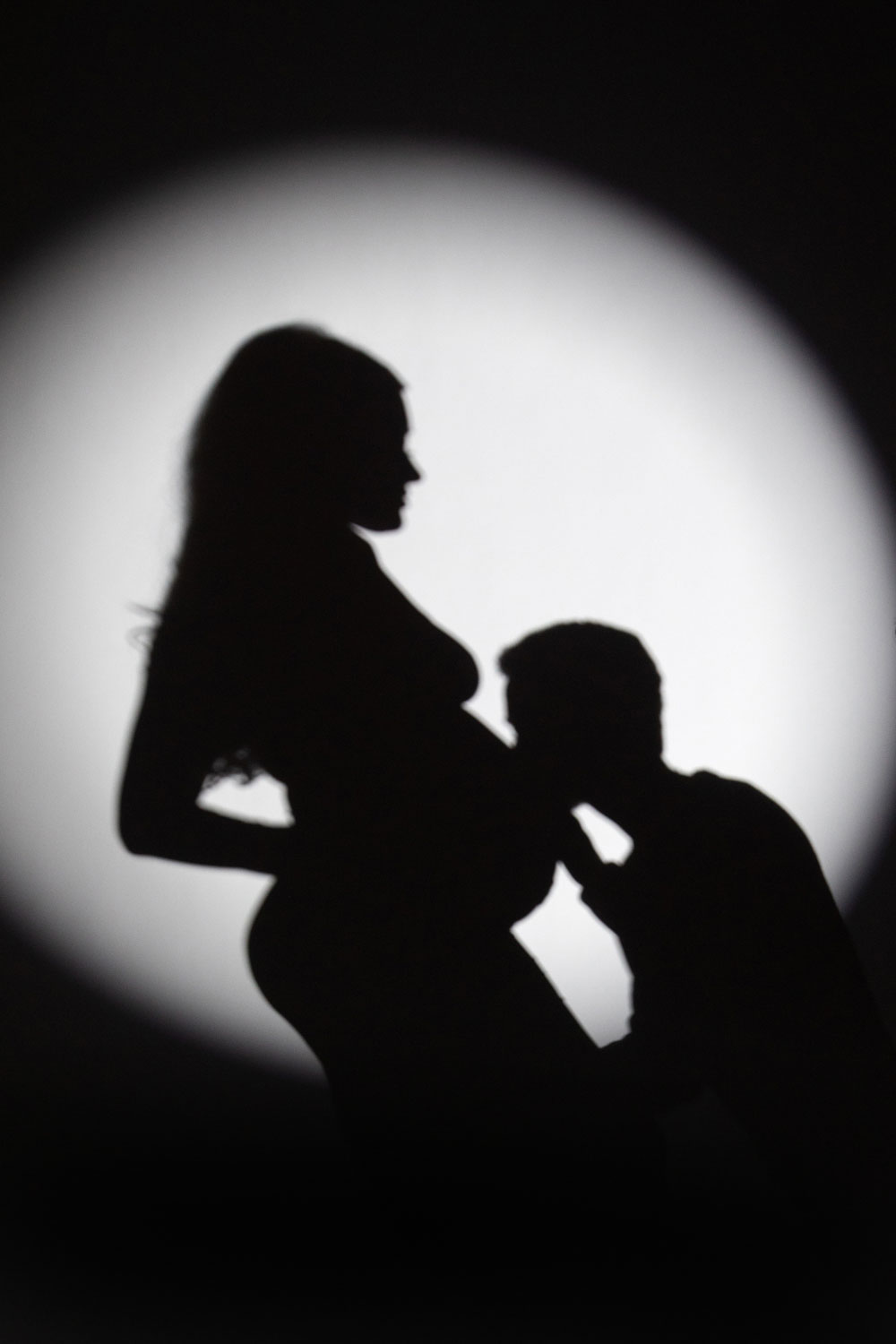 Maternity couple photoshoot spotlight lighting Dallas Texas