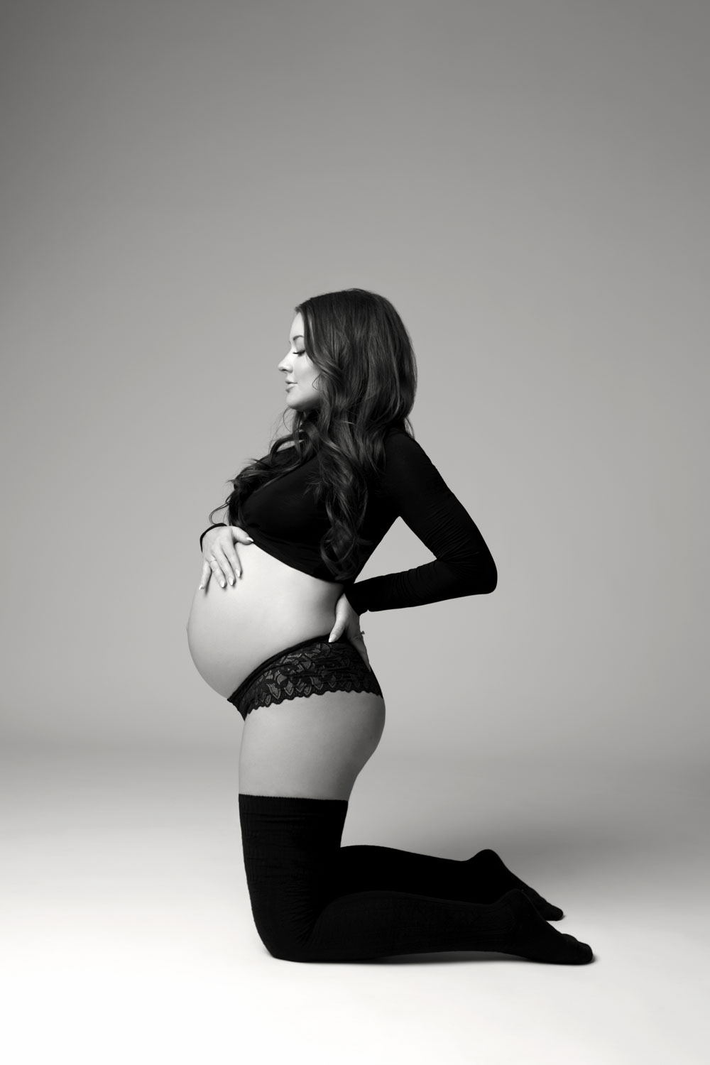 Strong maternity portrait black two piece Dallas studio session