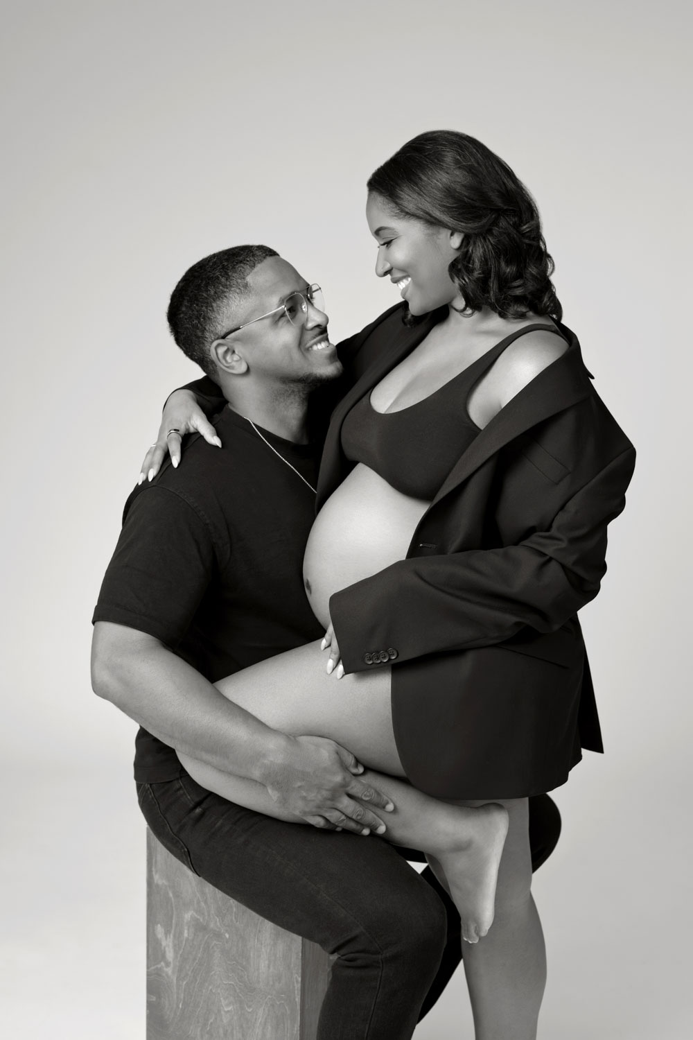 Pregnant couple embracing during Dallas maternity session